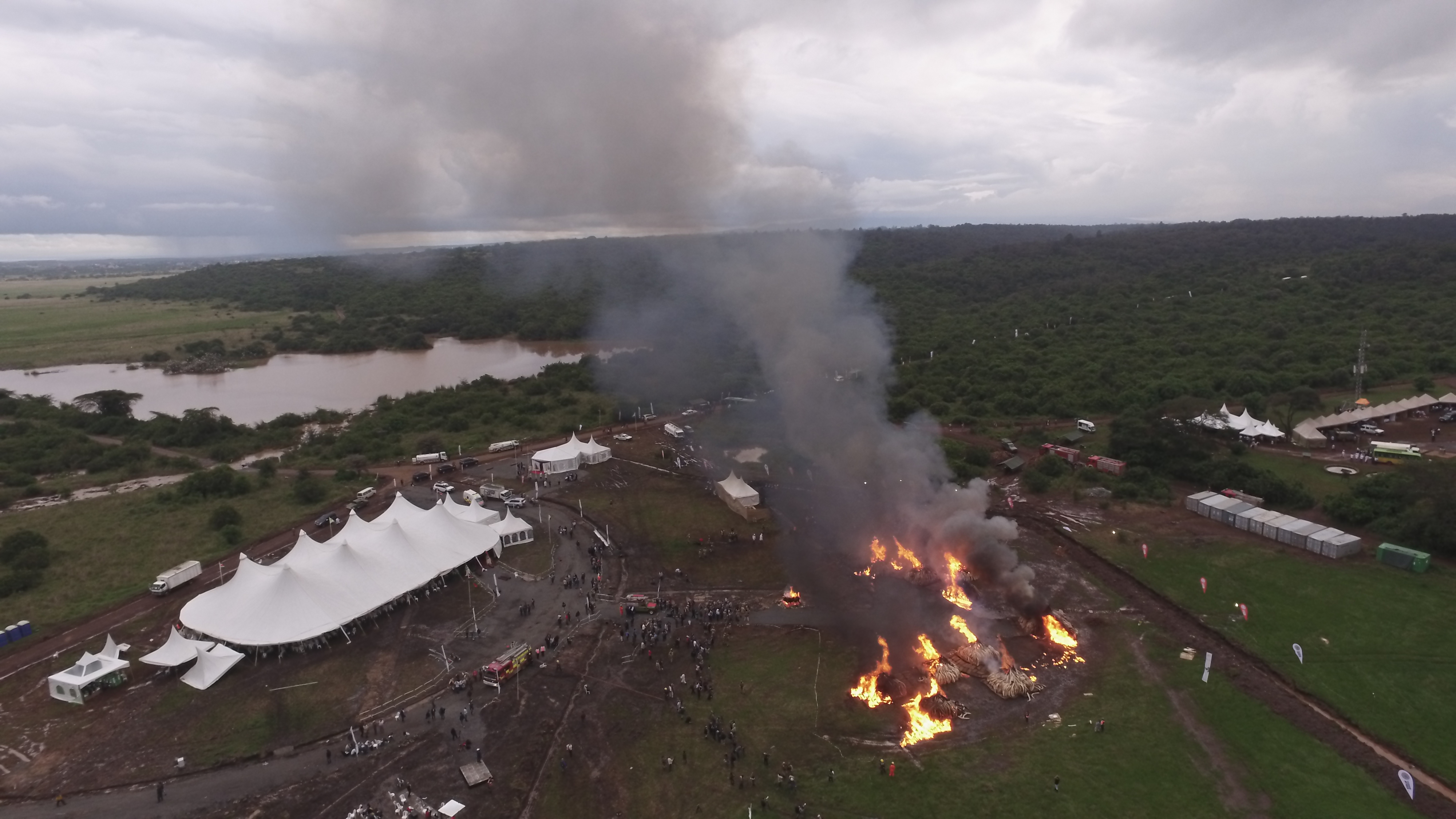 Aerial of a major production event with marquees and crew on a Kenyan conservancy